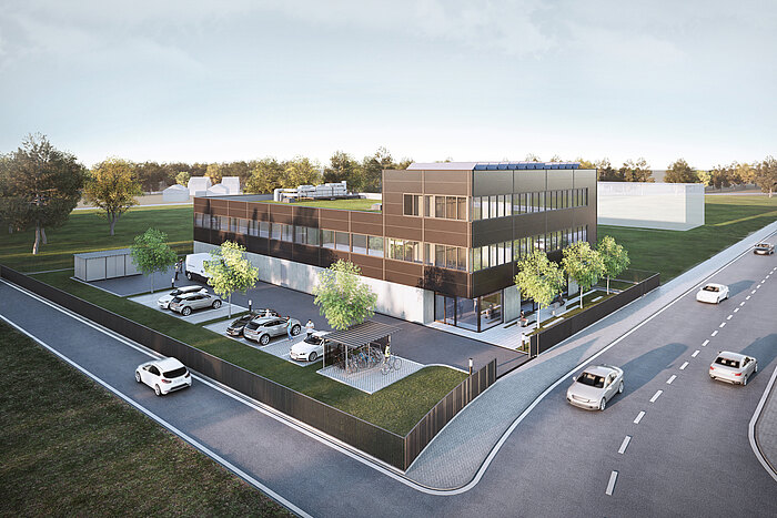 Rendering des Gebäudes eines produzierenden Betriebs mit Parkplätzen, umgeben von Straßen mit PKW.